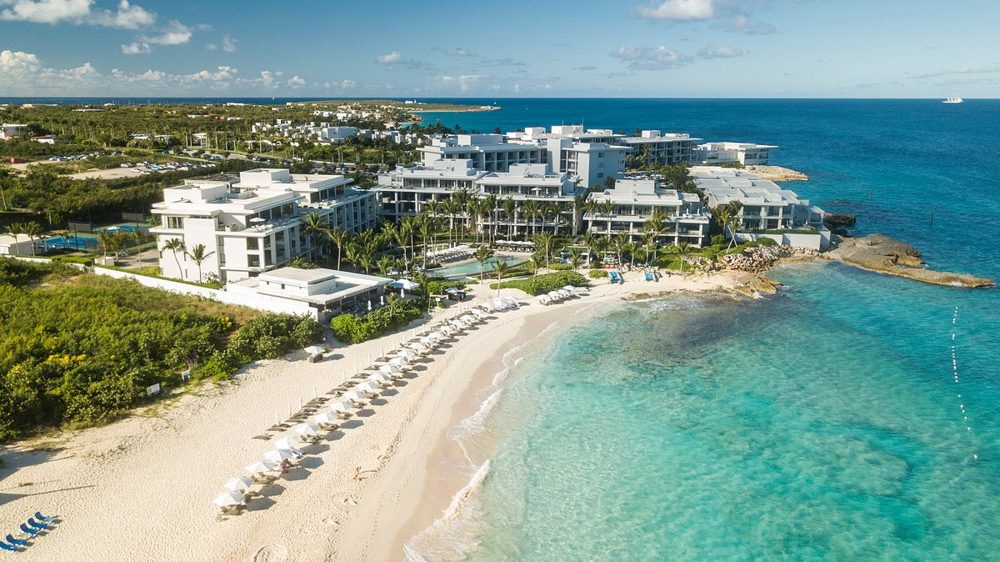 A beachfront resort above a white-sand bay in Anguilla