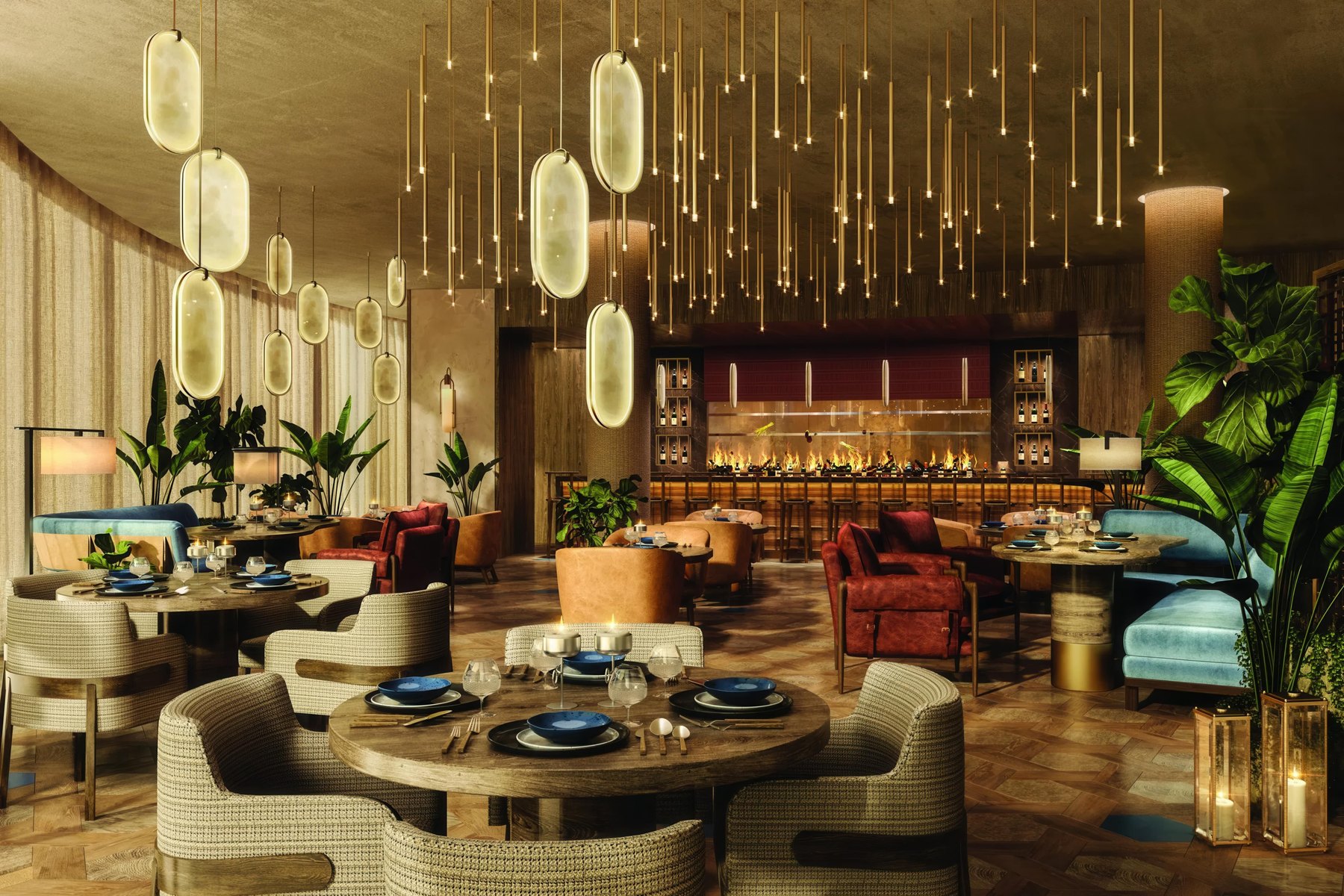 Warmly lit resort restaurant with pendant lighting and open kitchen at St Regis Cap Cana