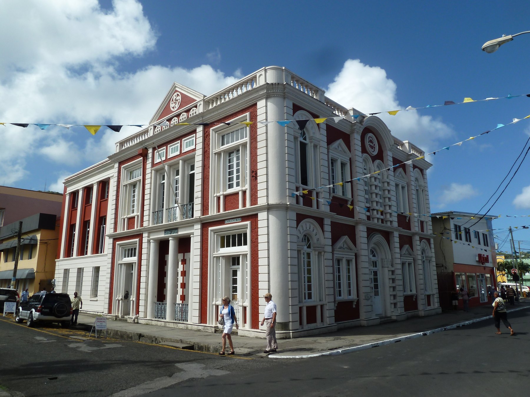Red and white colonial Central Library building on the Bourbon Street corner in Castries, St. Lucia