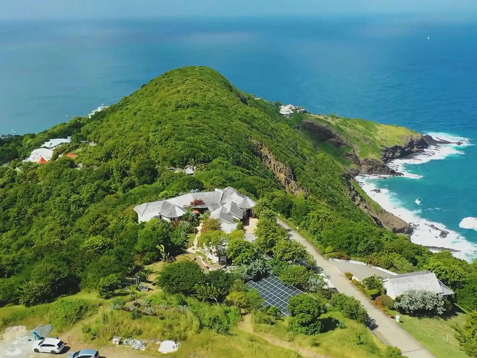 Clifftop villa on the green headland at the northern tip of St. Lucia above Atlantic surf