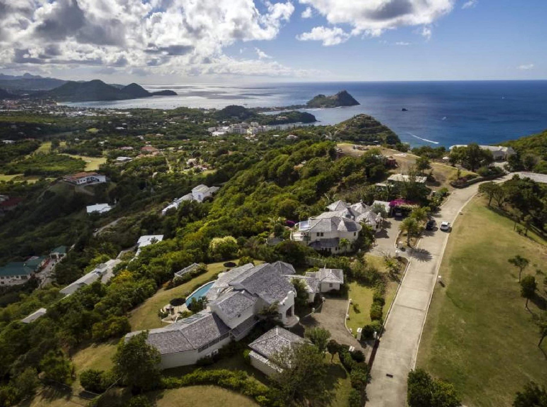 Aerial over Cap Estate villas and golf course in northern St. Lucia, looking across Rodney Bay to Pigeon Island