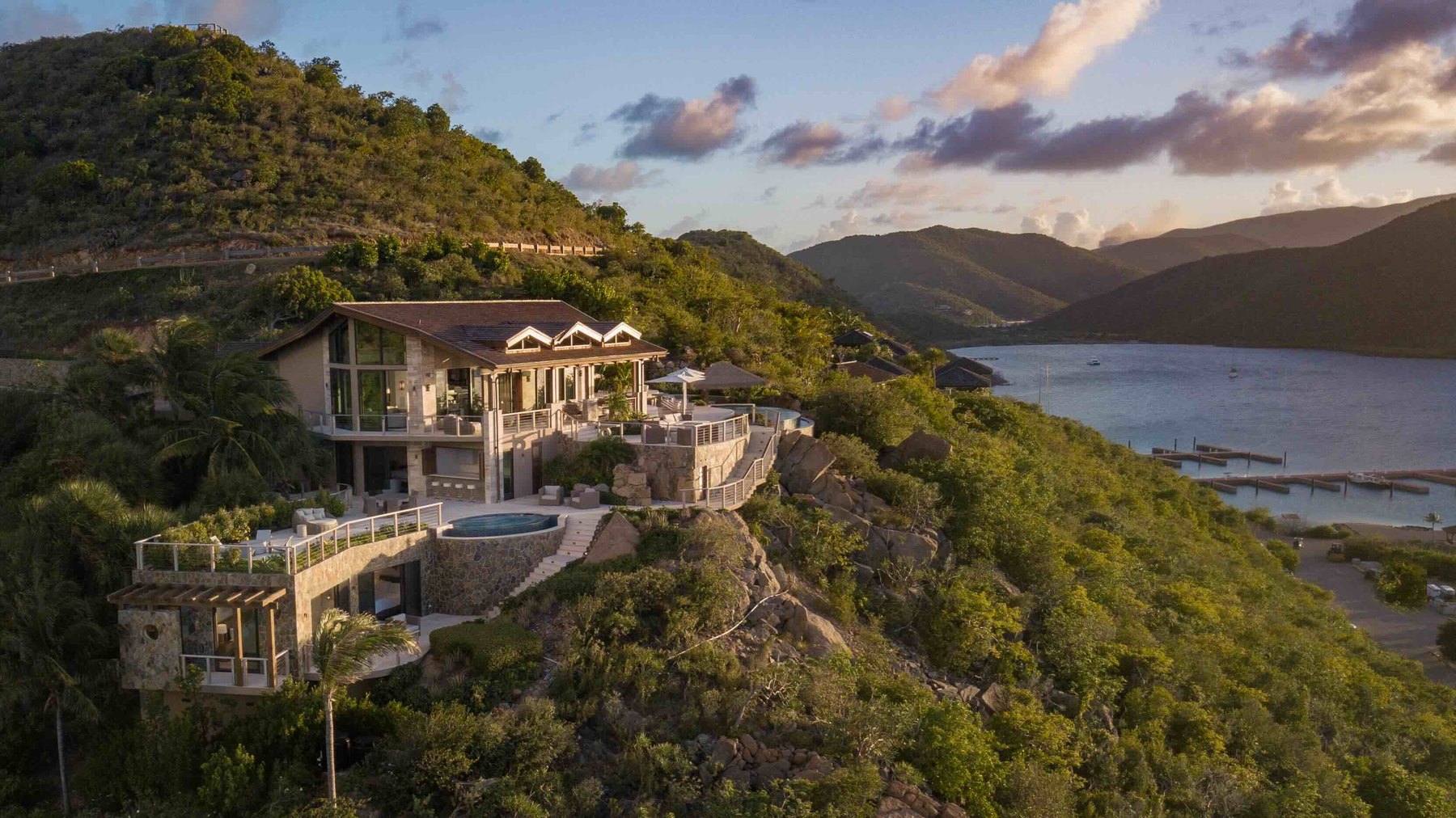 Hillside stone villa with plunge pool at golden hour, Oil Nut Bay, Virgin Gorda