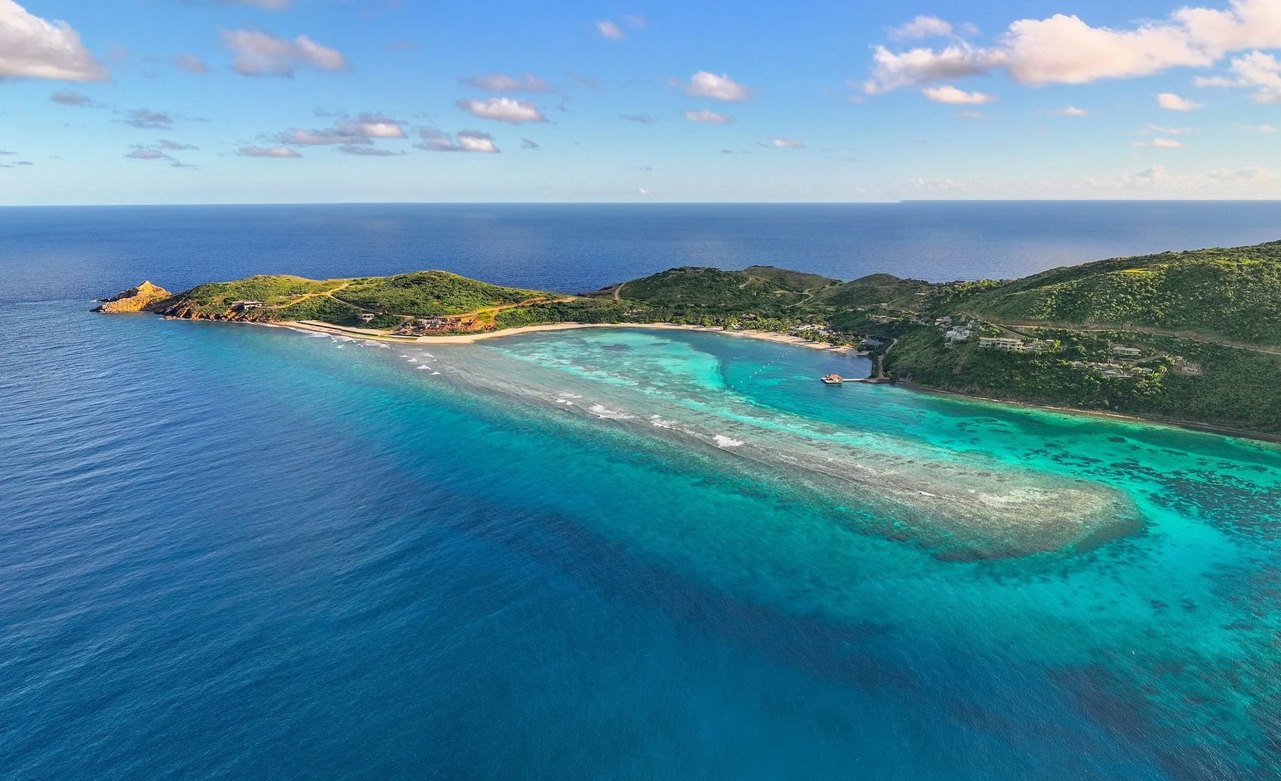 Aerial of the reef and peninsula sheltering Oil Nut Bay on eastern Virgin Gorda