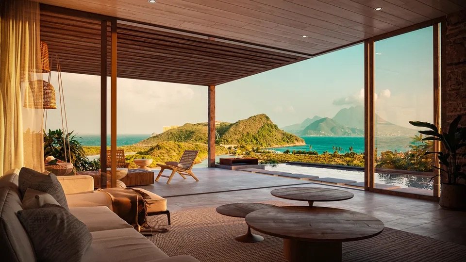 Open-plan living room with sliding glass walls facing a pool and coastal headland