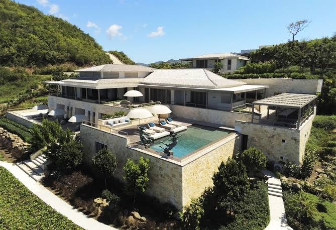 Infinity pool and sun terrace of a hillside stone villa at Pearns Point, Antigua