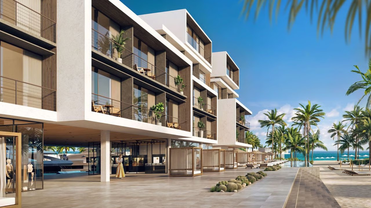 Artist's rendering of Port Nimara's waterfront promenade, ground-floor retail and balconied residences, Anguilla