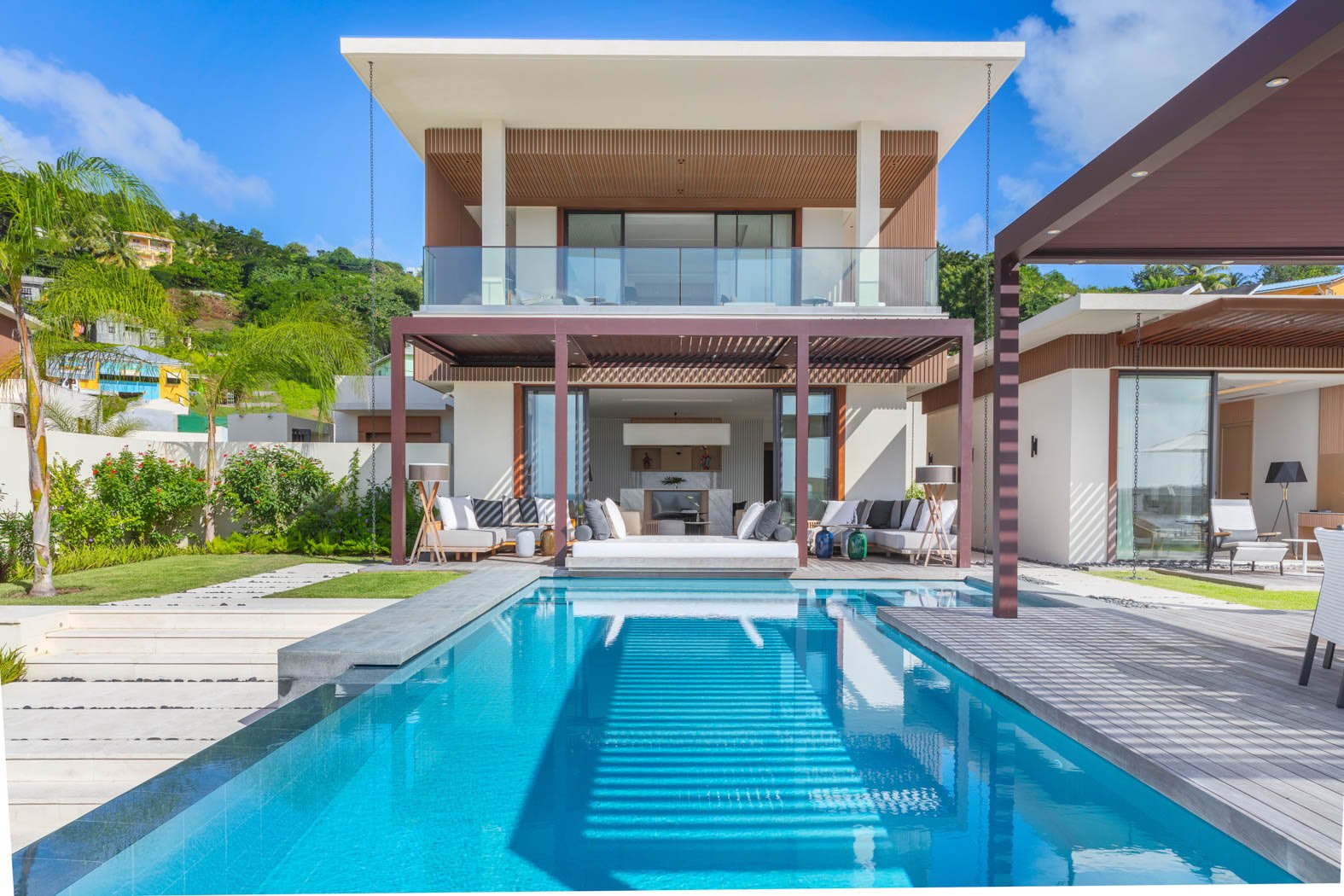 Two-storey Silversands villa at Grand Anse with private pool and green Grenadian hillside behind