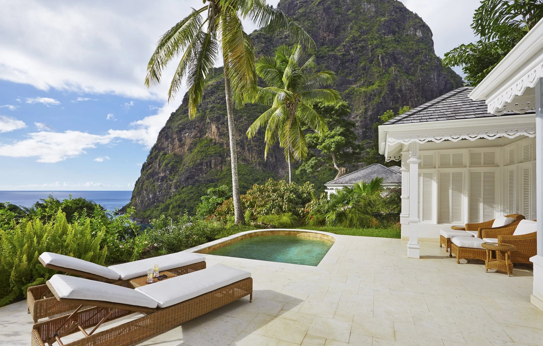 Private plunge pool and loungers on a villa terrace facing Petit Piton, Sugar Beach, St. Lucia