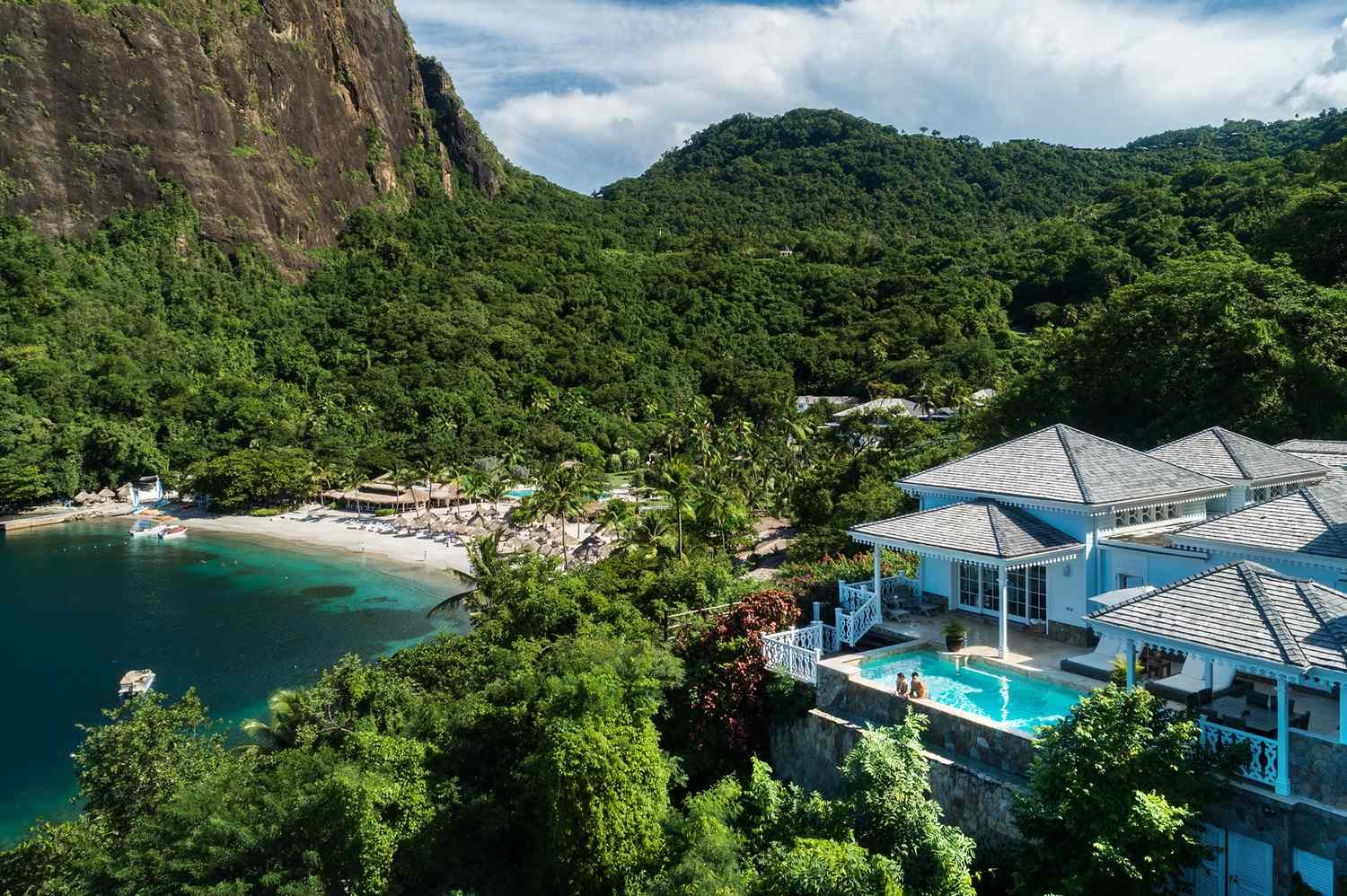 White hillside villa and private pool above the beach at Sugar Beach, Soufriere, St. Lucia