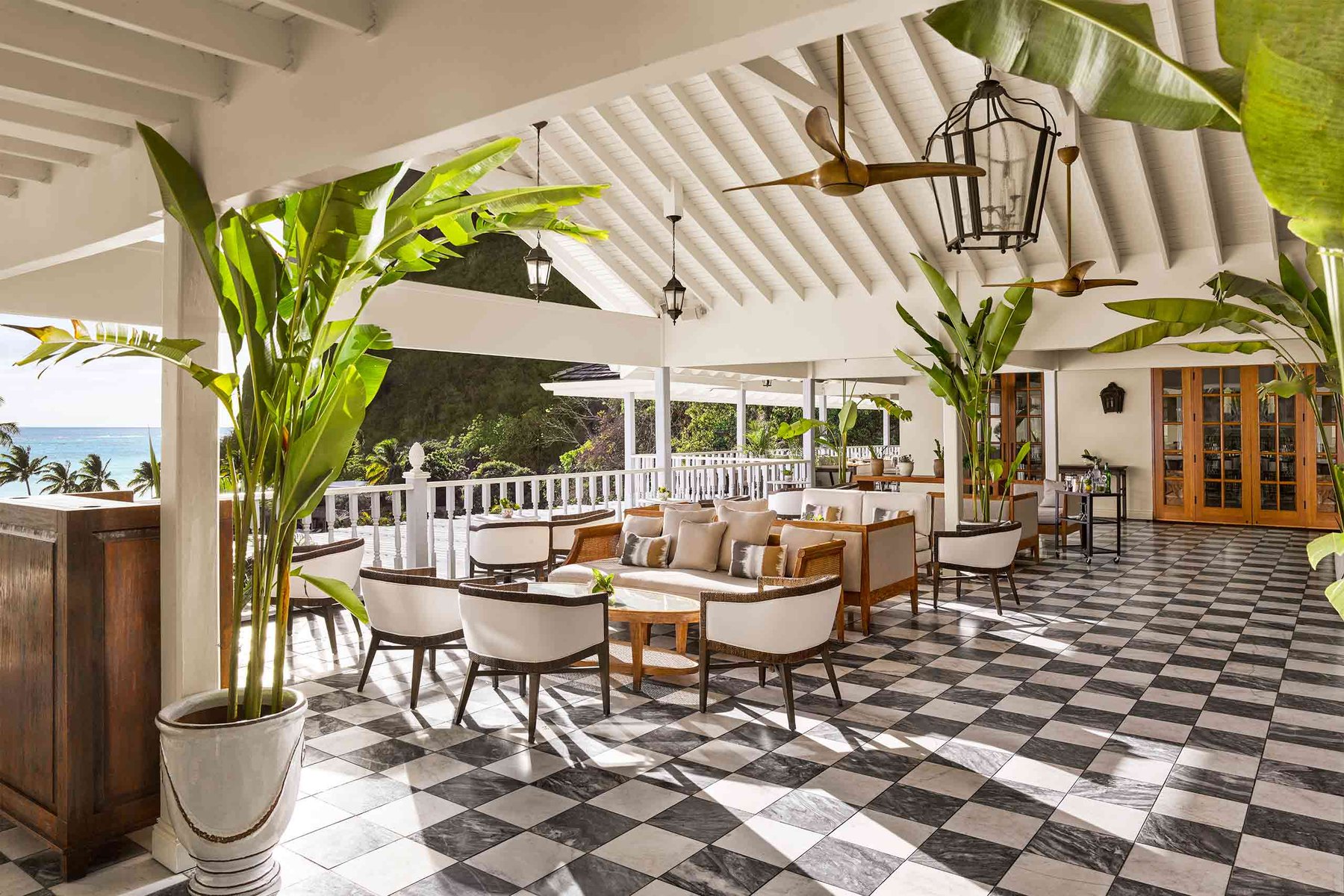 Great Room lounge at Sugar Beach with marble checkerboard floor and sea view, St. Lucia