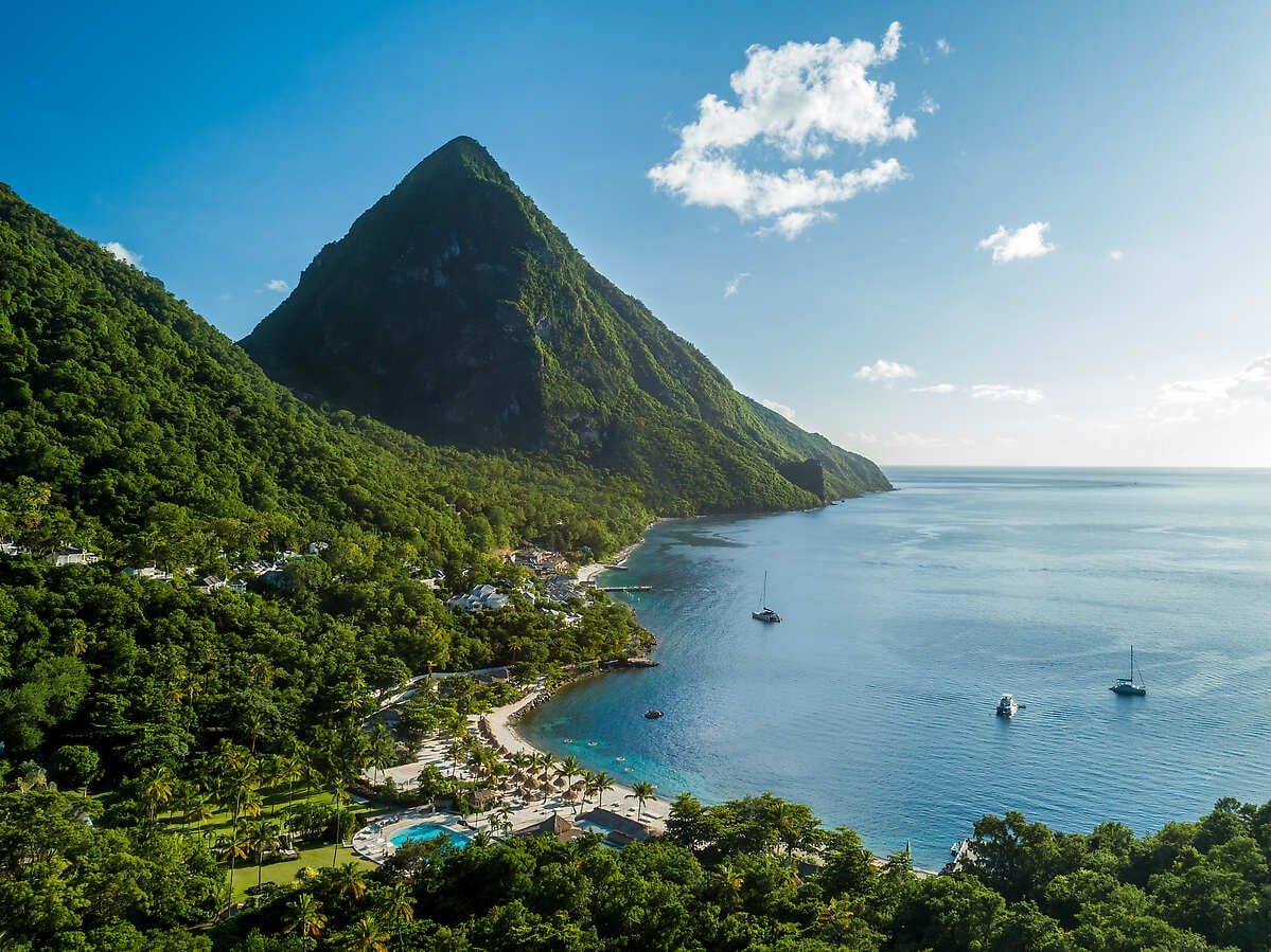 Aerial view of Petit Piton and Sugar Beach's bay with anchored yachts, Soufriere, St. Lucia
