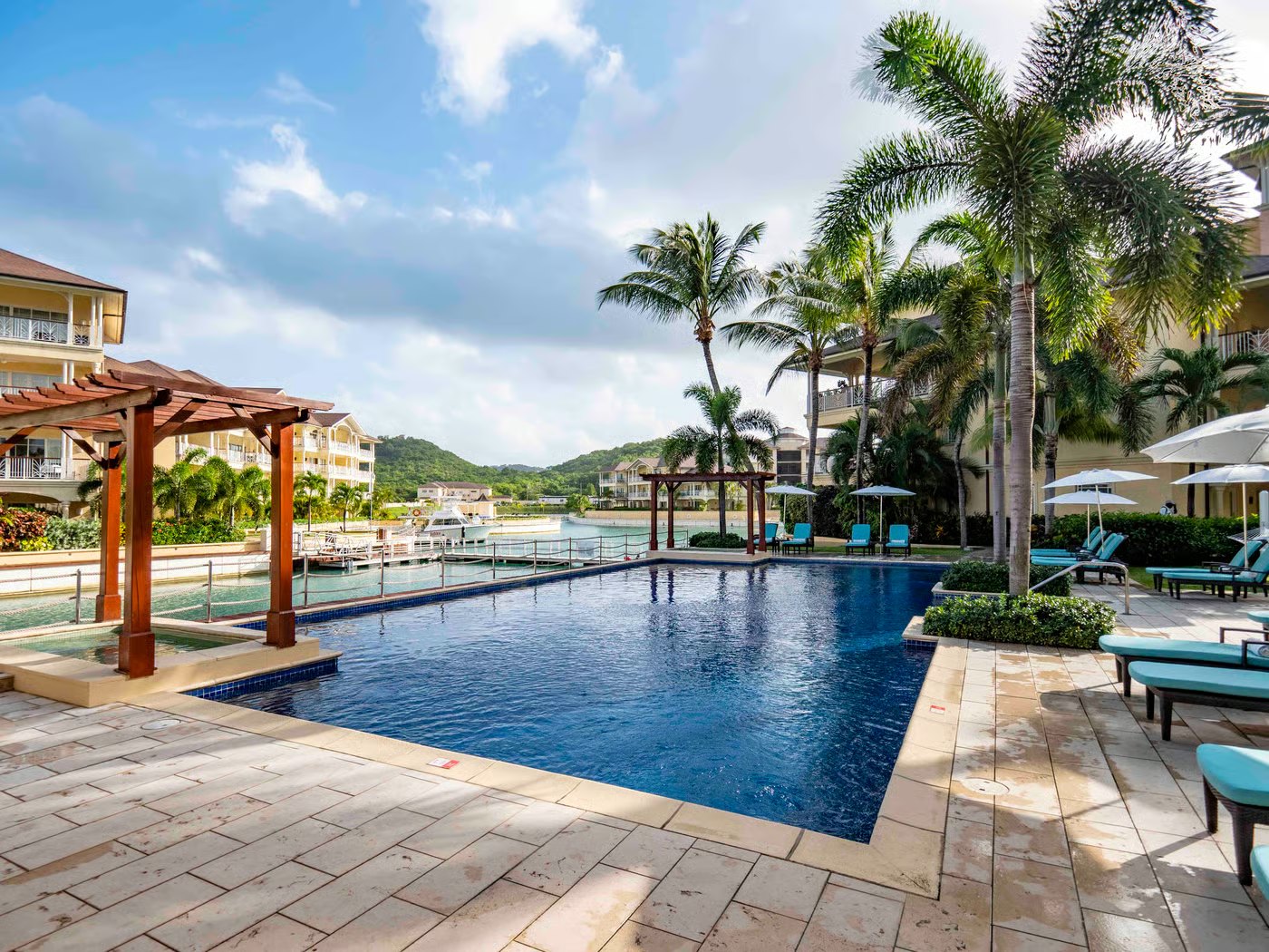 Marina-side swimming pool with loungers and pergolas at The Landings, Rodney Bay, St. Lucia
