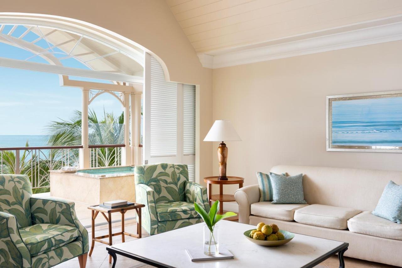 Living room of a suite at The Landings opening to a veranda plunge pool