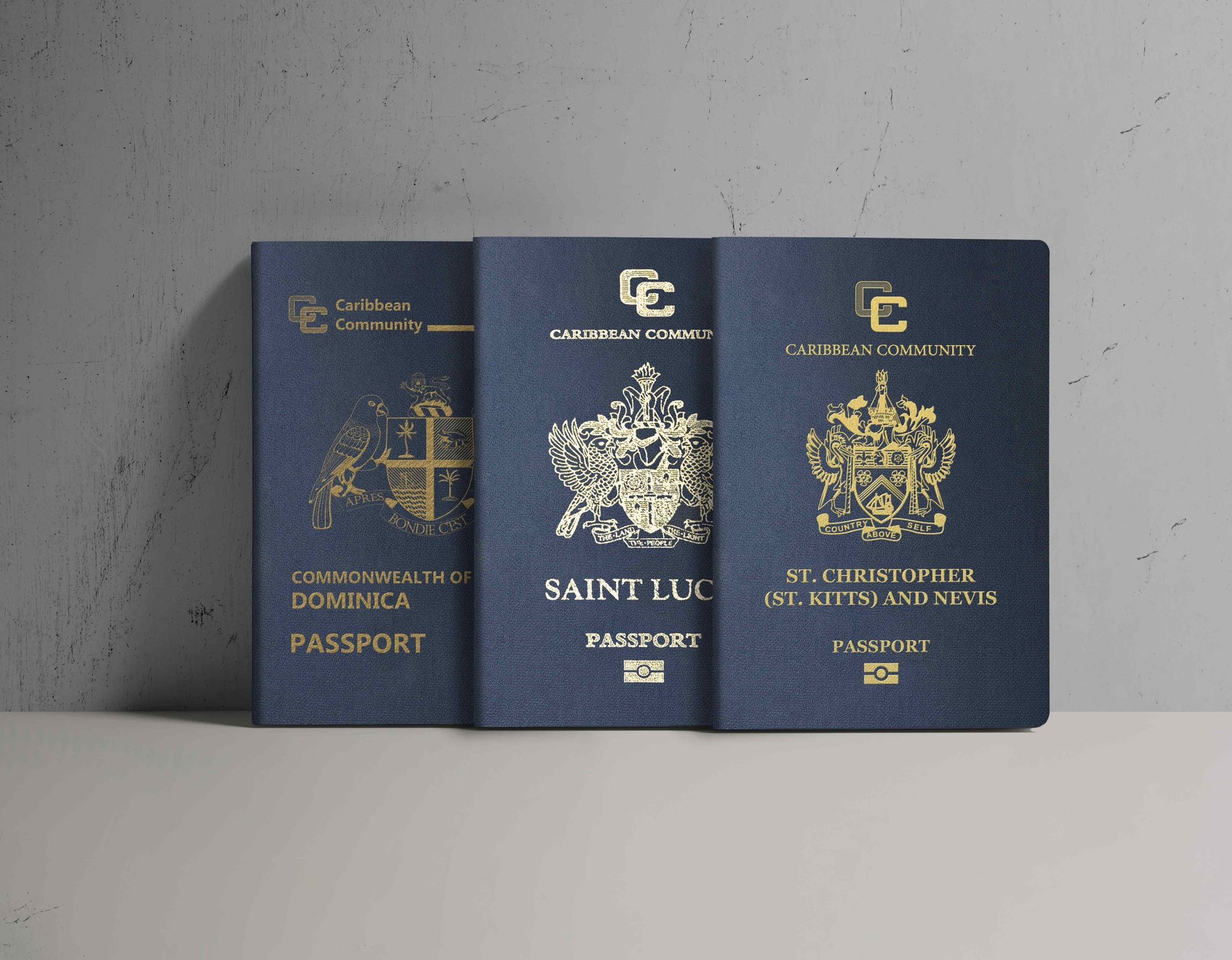 Three navy CARICOM passports — Dominica, St. Lucia and St Christopher (St Kitts) and Nevis — standing against a concrete wall