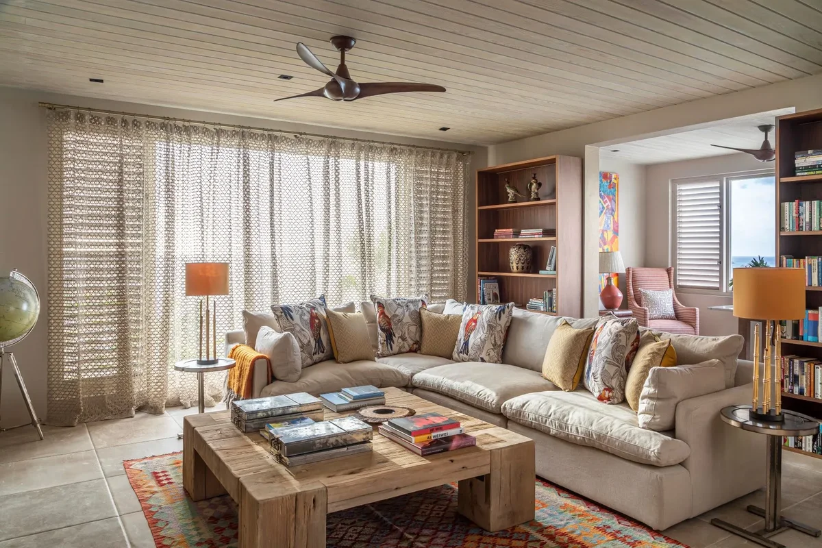 A sitting room with a long sectional