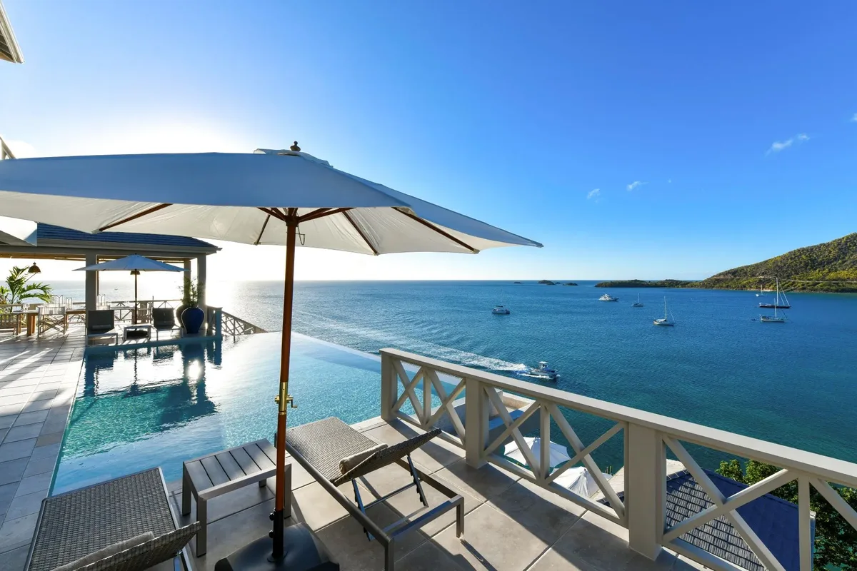 The pool terrace and shaded loungers