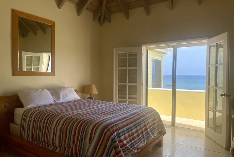 A bedroom opening onto the beach terrace