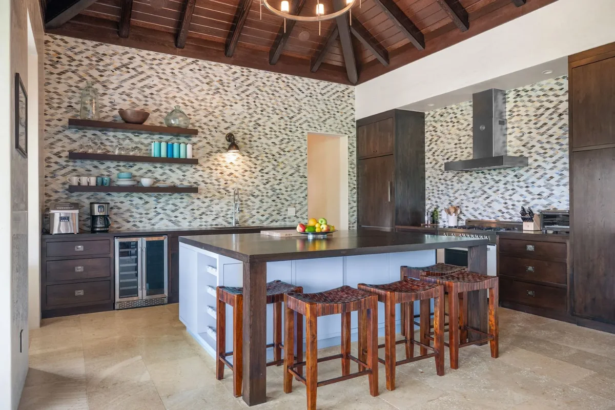 The kitchen island and bar stools