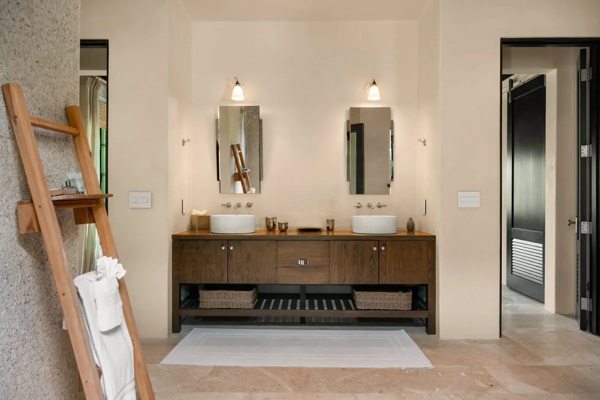 A bathroom with twin vessel basins
