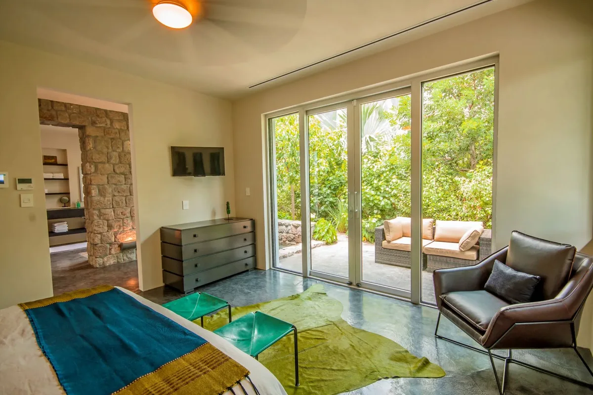 The bedroom opening to the terrace
