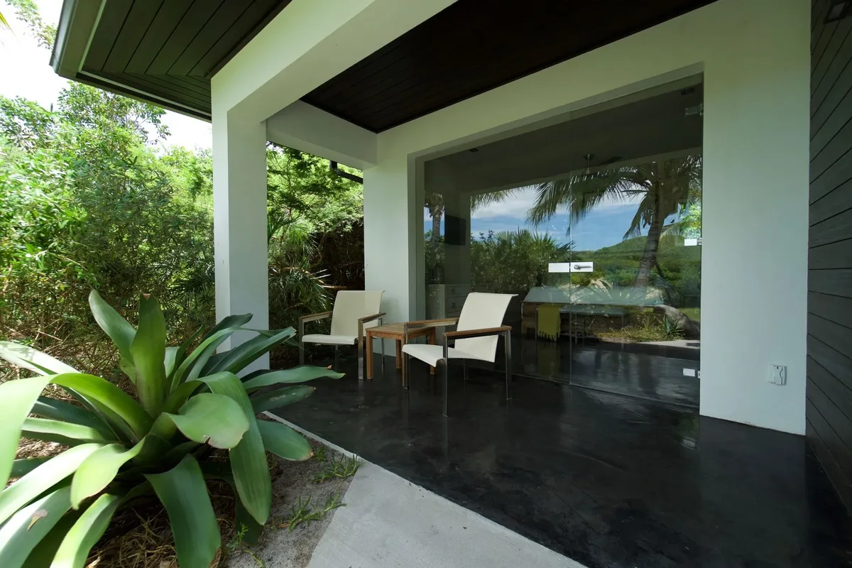The covered terrace open to the garden