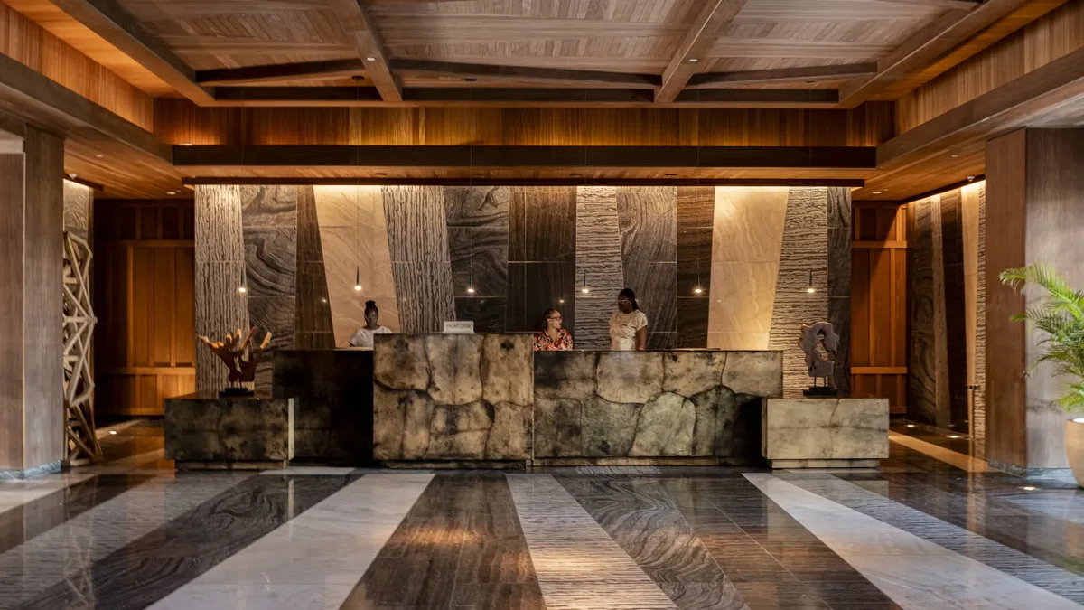 The arrival hall in stone and timber