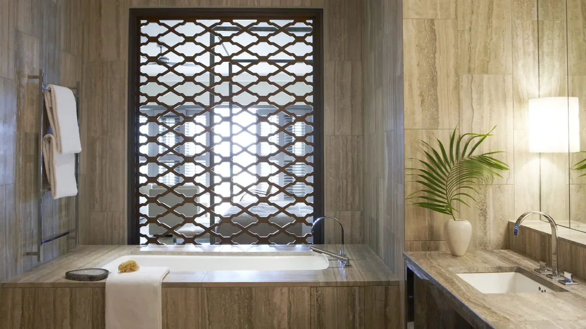 The bathroom with a sunken tub