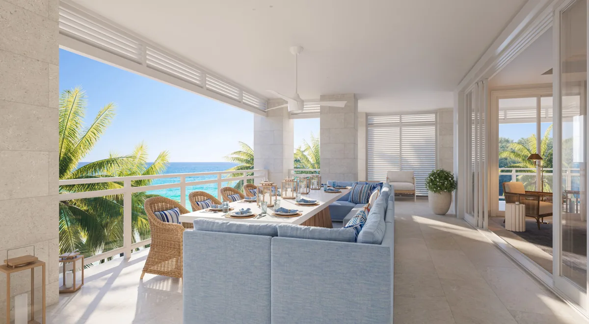 Artist’s rendering of a living room opening to a dining terrace and the sea