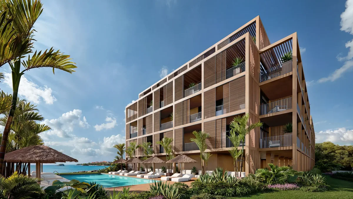 Artist’s rendering of three-quarter view of the building from the garden side, pool and thatched umbrellas at left, sea beyond. 2560x1440