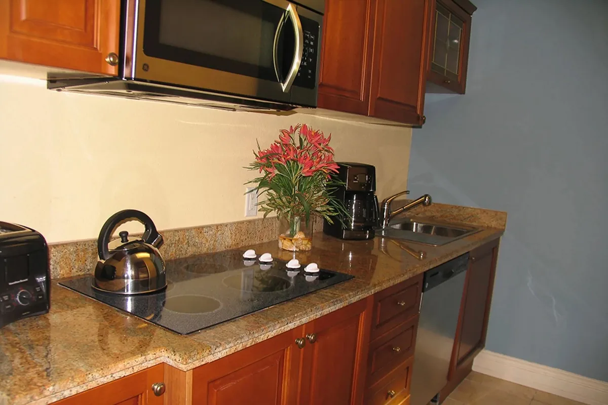 The kitchen from the dining side, with dishwasher and prep counter