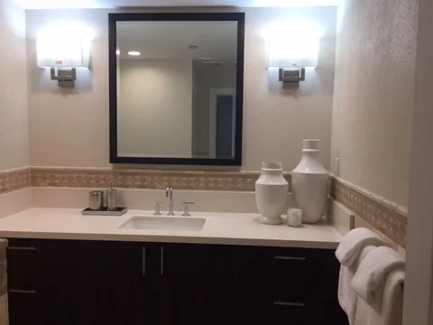 a bathroom vanity and mirror