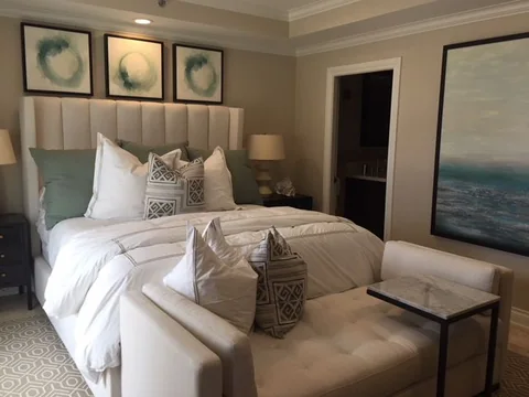 the primary bedroom, with an upholstered headboard