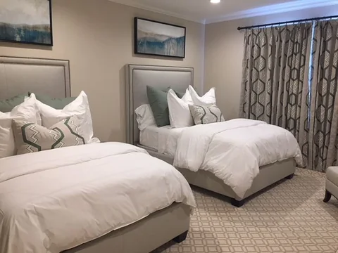 the second bedroom, with two double beds