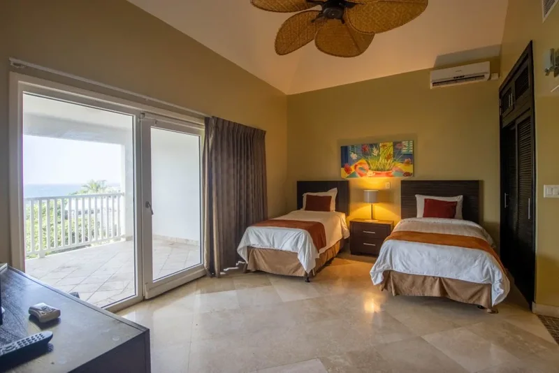 A twin bedroom opening to the terrace