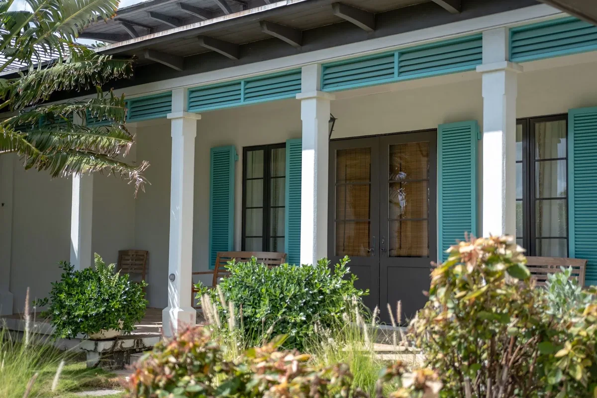 The shaded verandah and shuttered doors